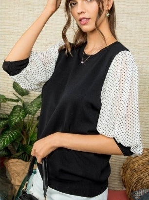 Black knit top with contrast sleeves