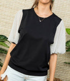 Black knit top with contrast sleeves